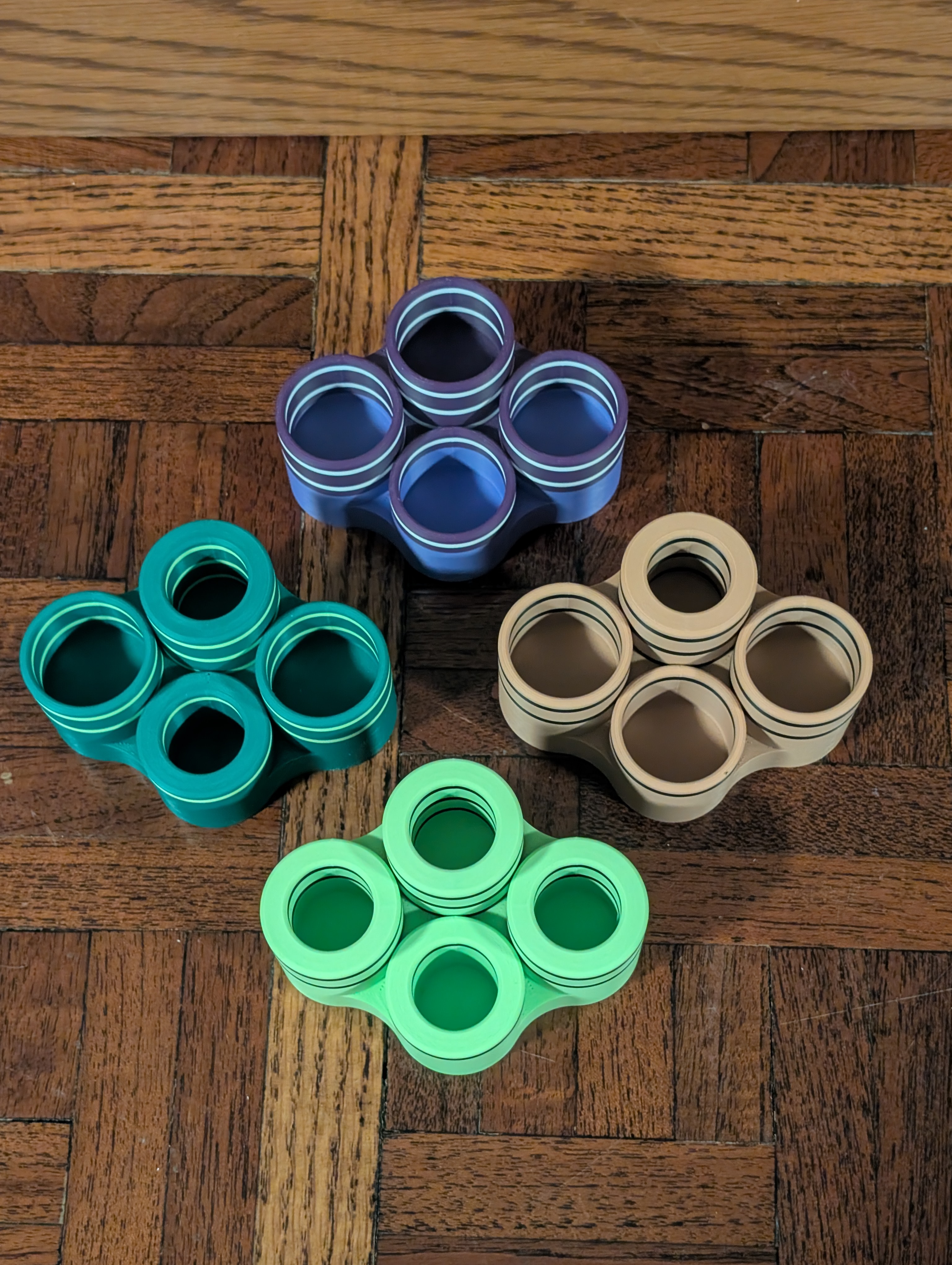 Four Table 4 racks showing different hole configurations and colors