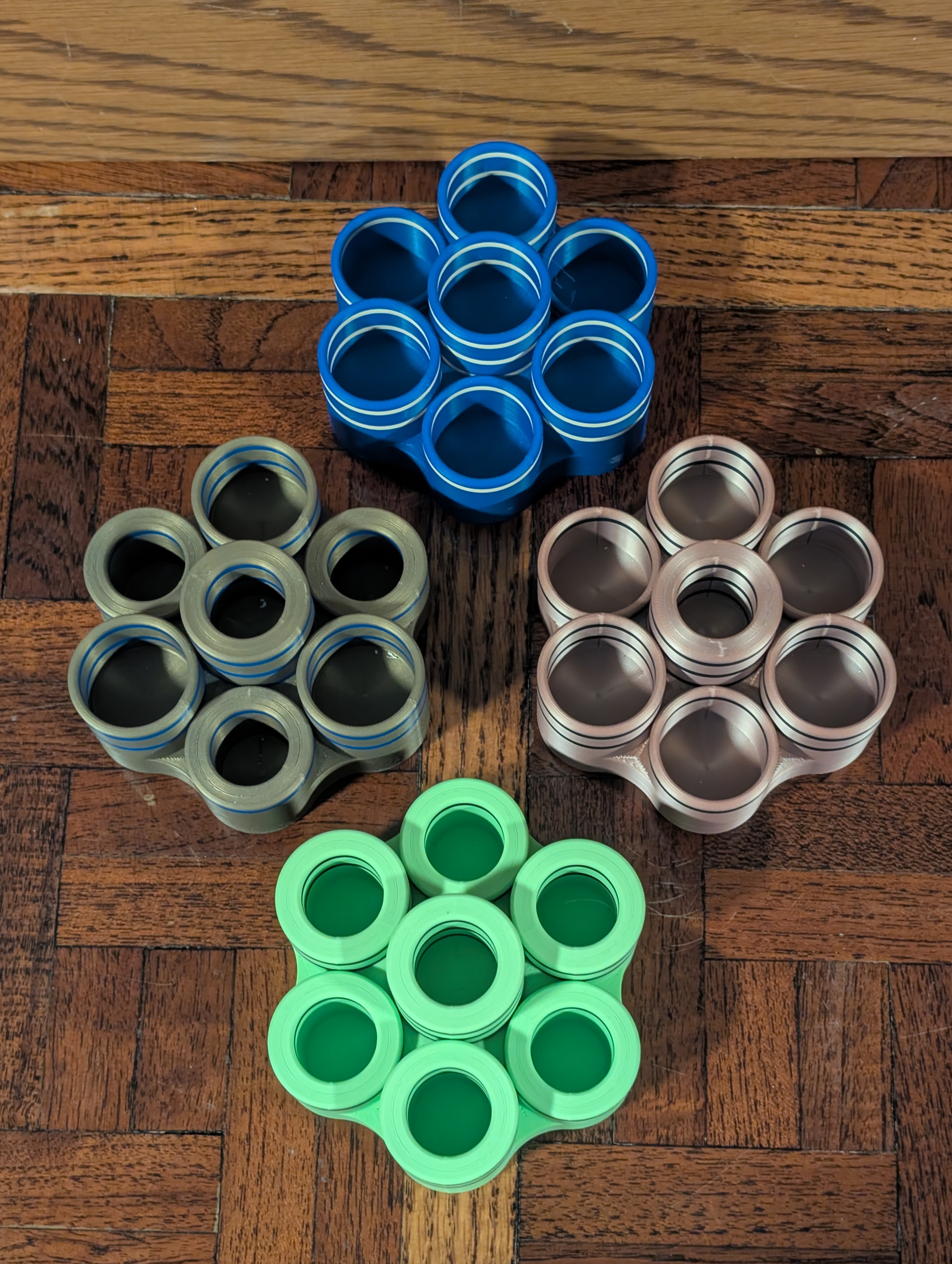 Four Table 7 racks showing different hole configurations and colors